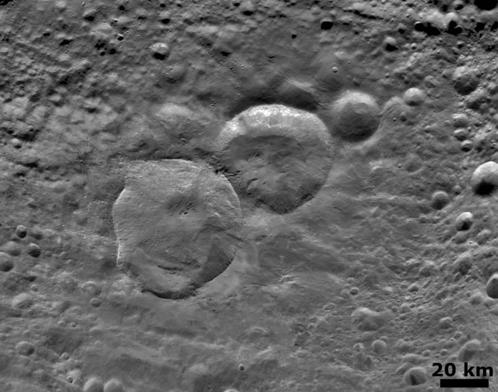 An image of the 3 iconic craters of Vespa dubbed the
        "snowman"